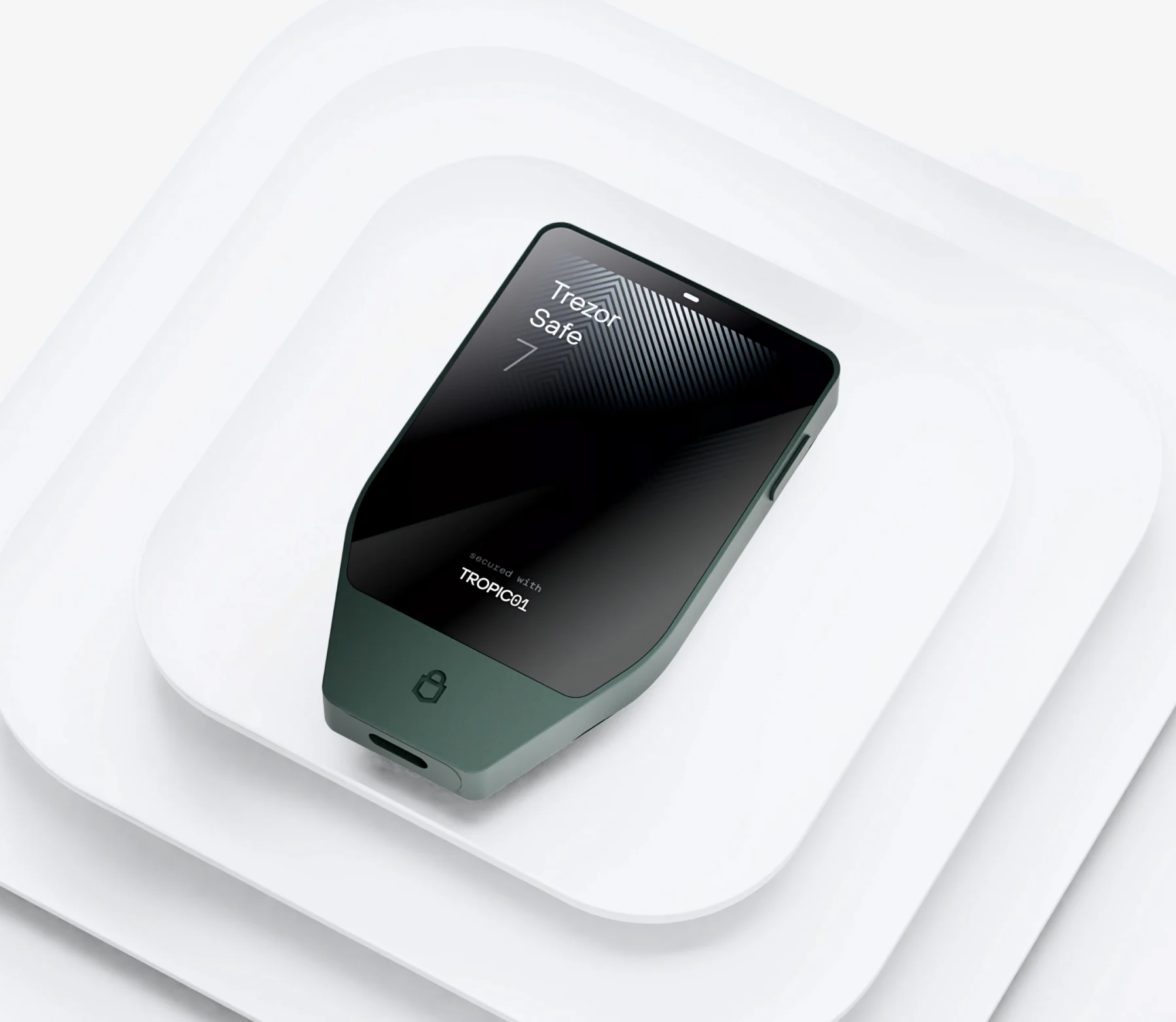 A black Trezor Safe device resting on stacked white platforms.