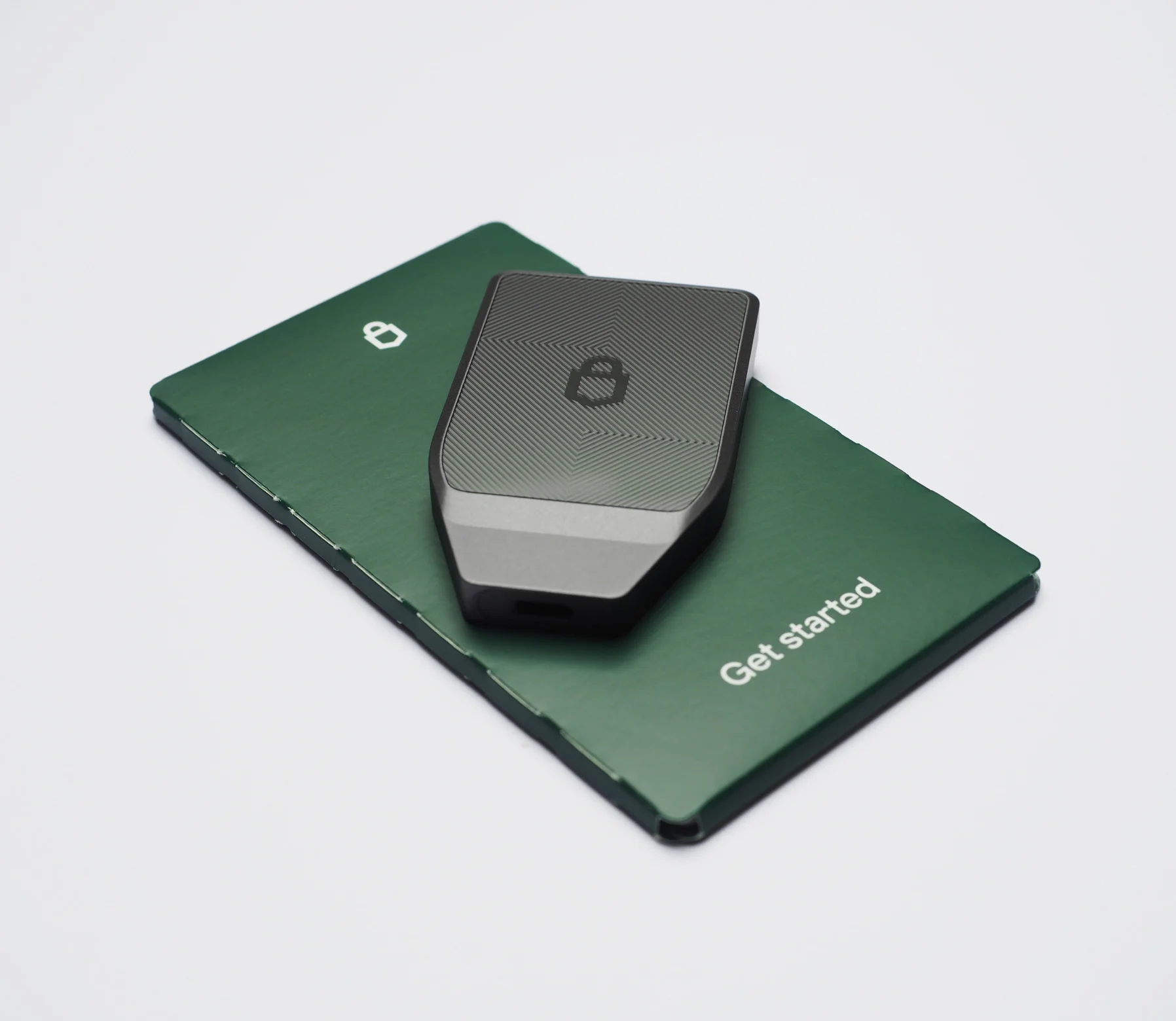 The graphite Safe 7 resting on its green “Get started” card.