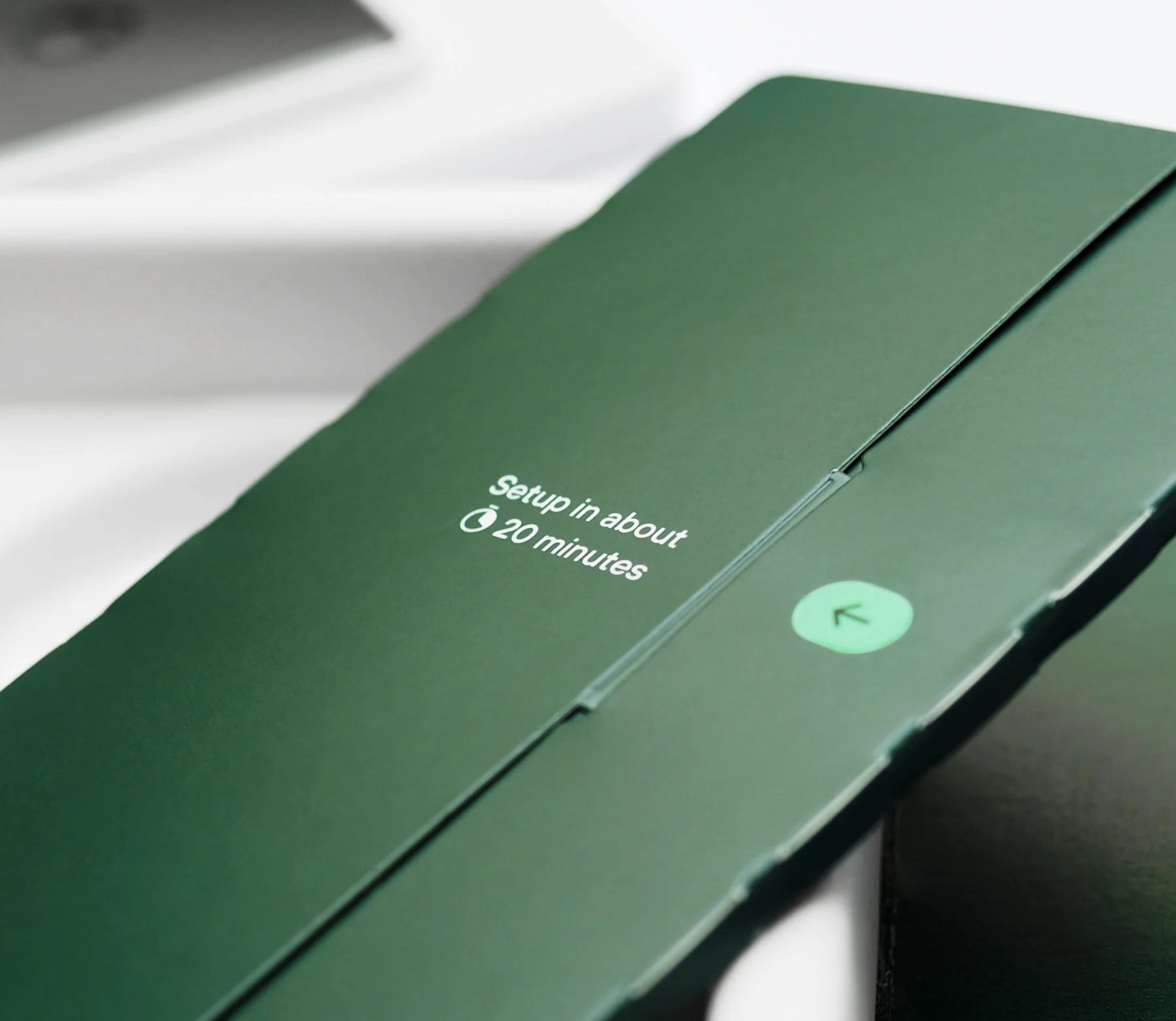 A detail of the green pack — “Setup in about 20 minutes” beside a mint back-arrow button.
